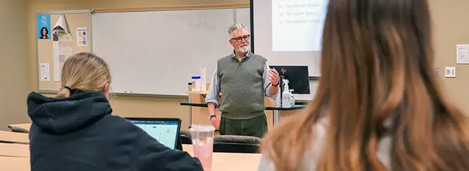 Instructor at Hawkeye leading a history discussion at Hawkeye Community College.