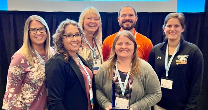 Representatives from Hawkeye Community College accept the Exemplary Noncredit Workforce Program Award during the National Council for Workforce Education Conference in Baltimore, Maryland. 