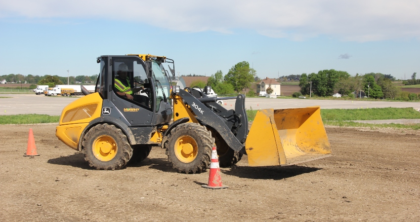 person operating a backhoe