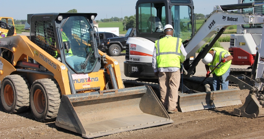 person operating a backhoe